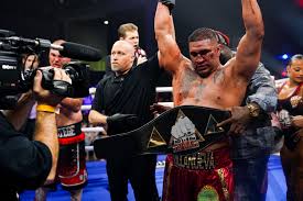 Ike Villanueva gets his hand raised after winning the BYB Heavyweight Title.